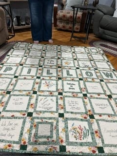Quilt laid out on floor display